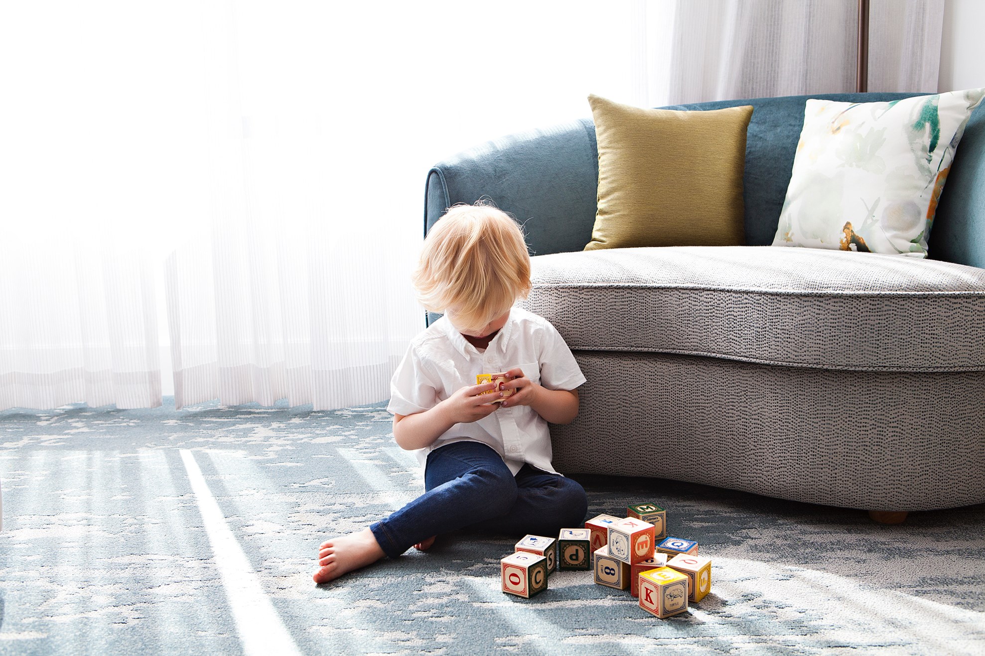 little boy playing with blocks on clean carpet in Cokomo IN